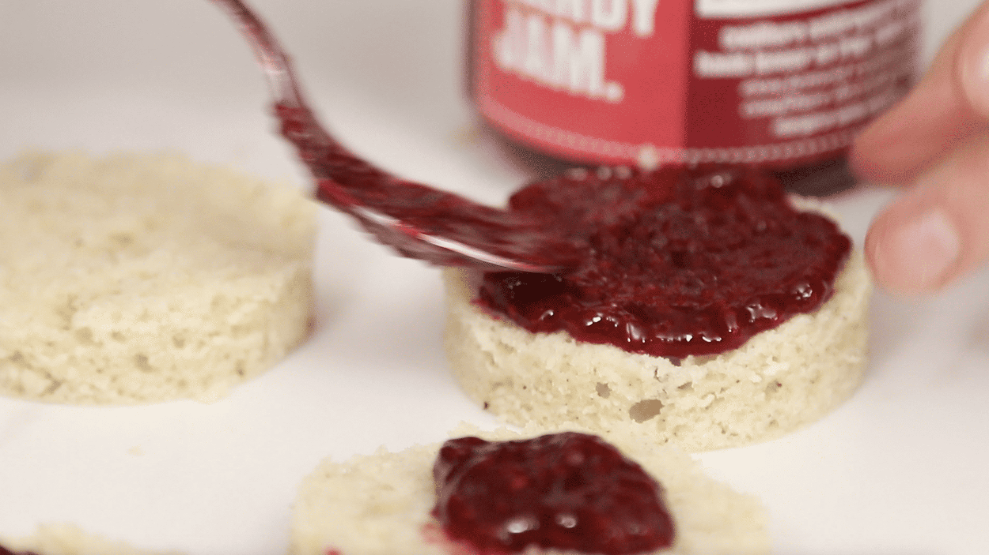 jam being spread on cake rounds