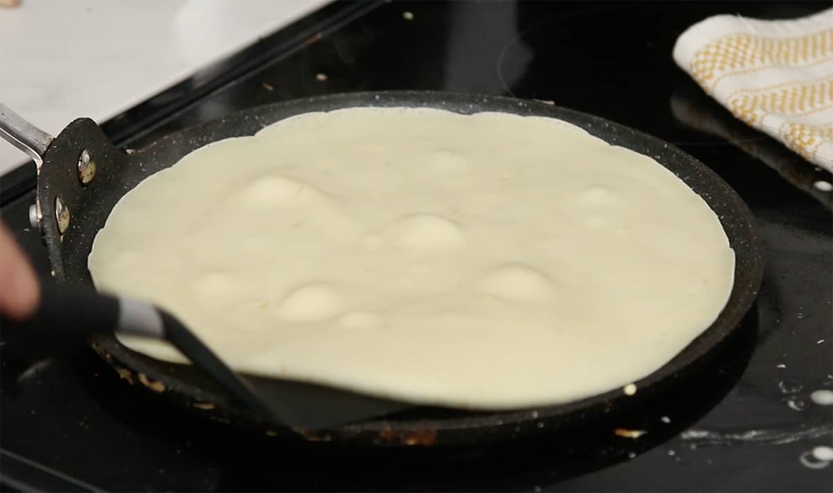 crepe being made on a crepe pan