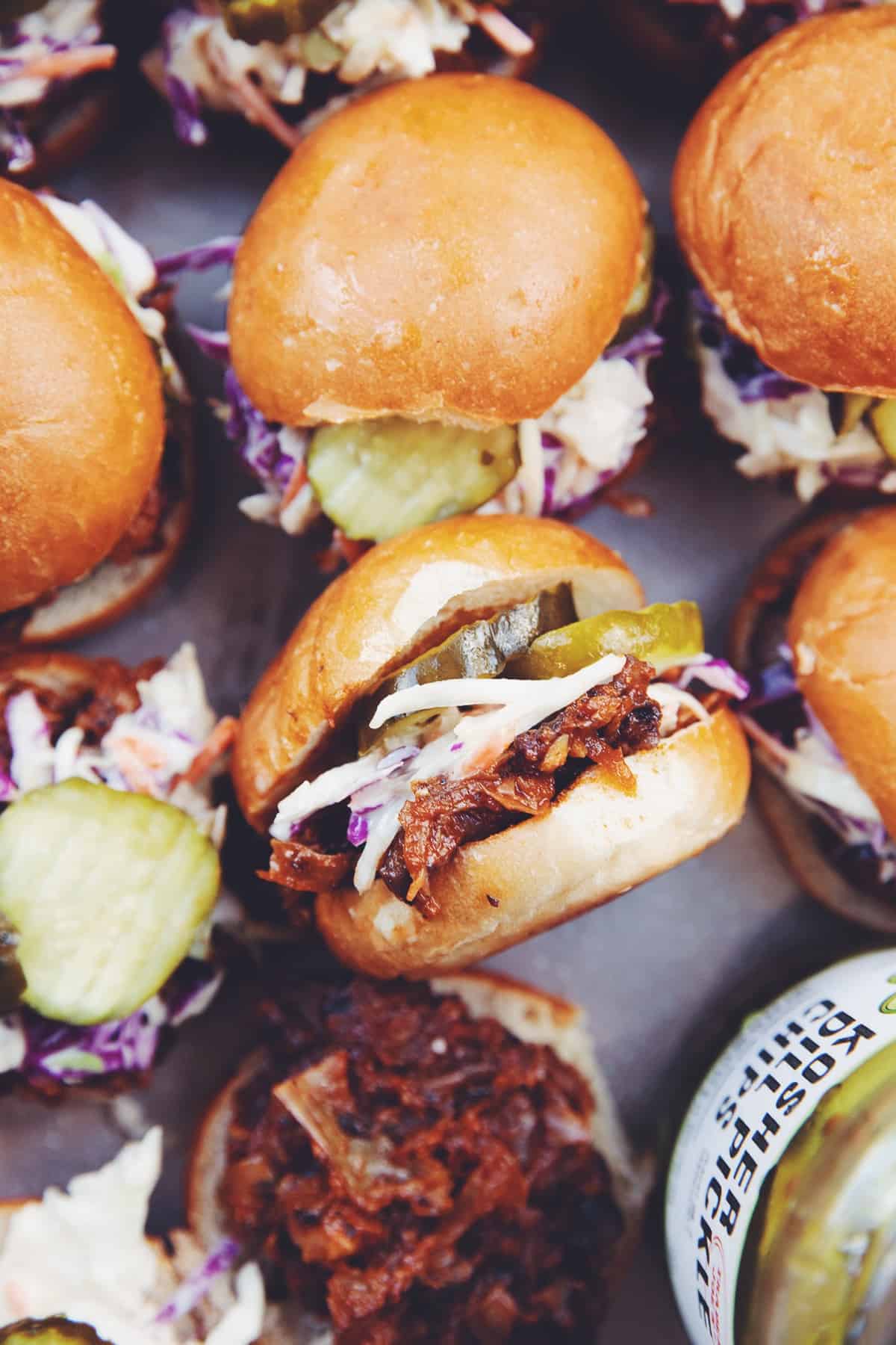 overhead of vegan pulled pork sliders on a tray