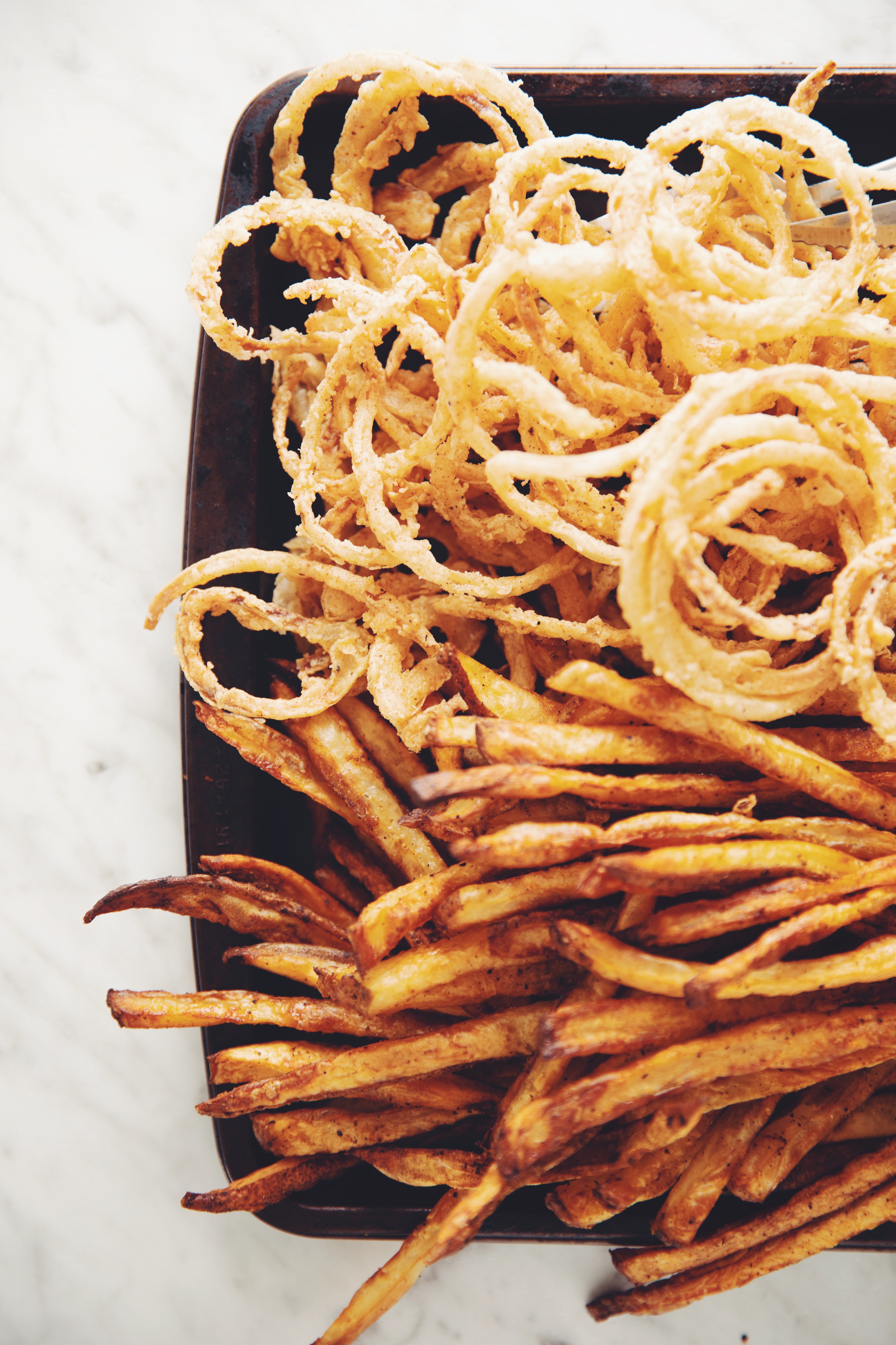 baked fries and crispy onion strings_ hot for food