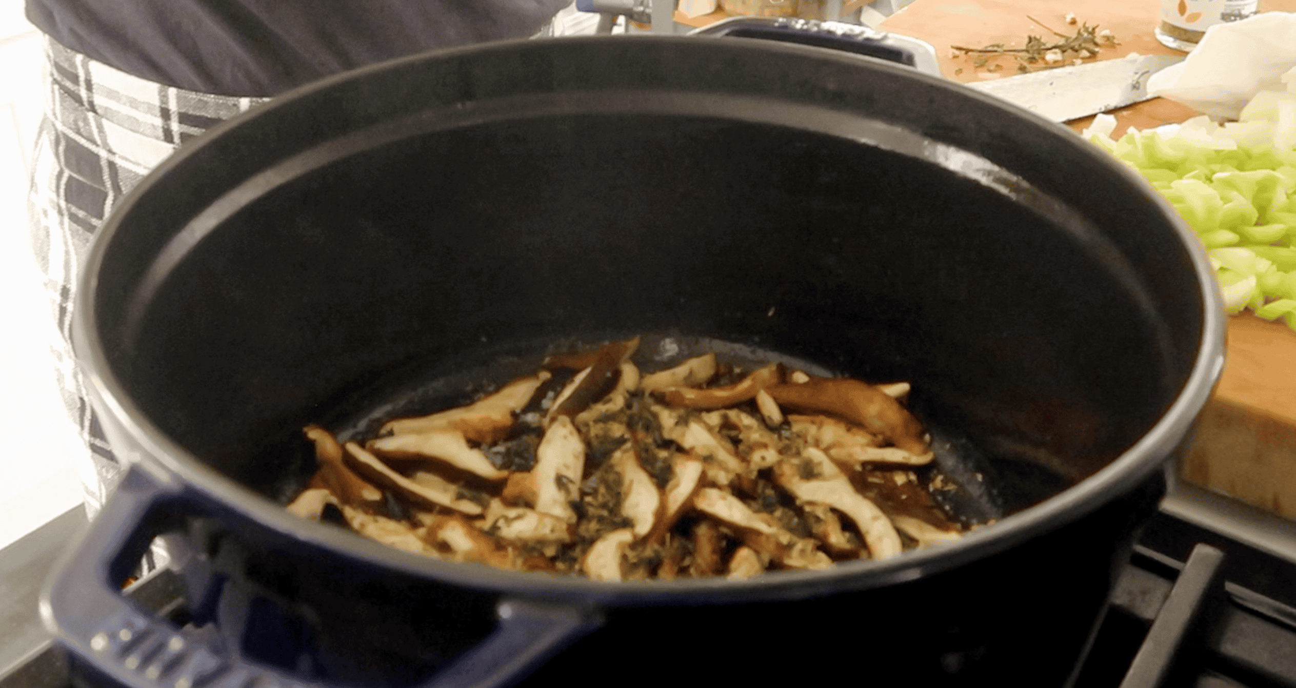 a large pot with shitake mushrooms cooking in it