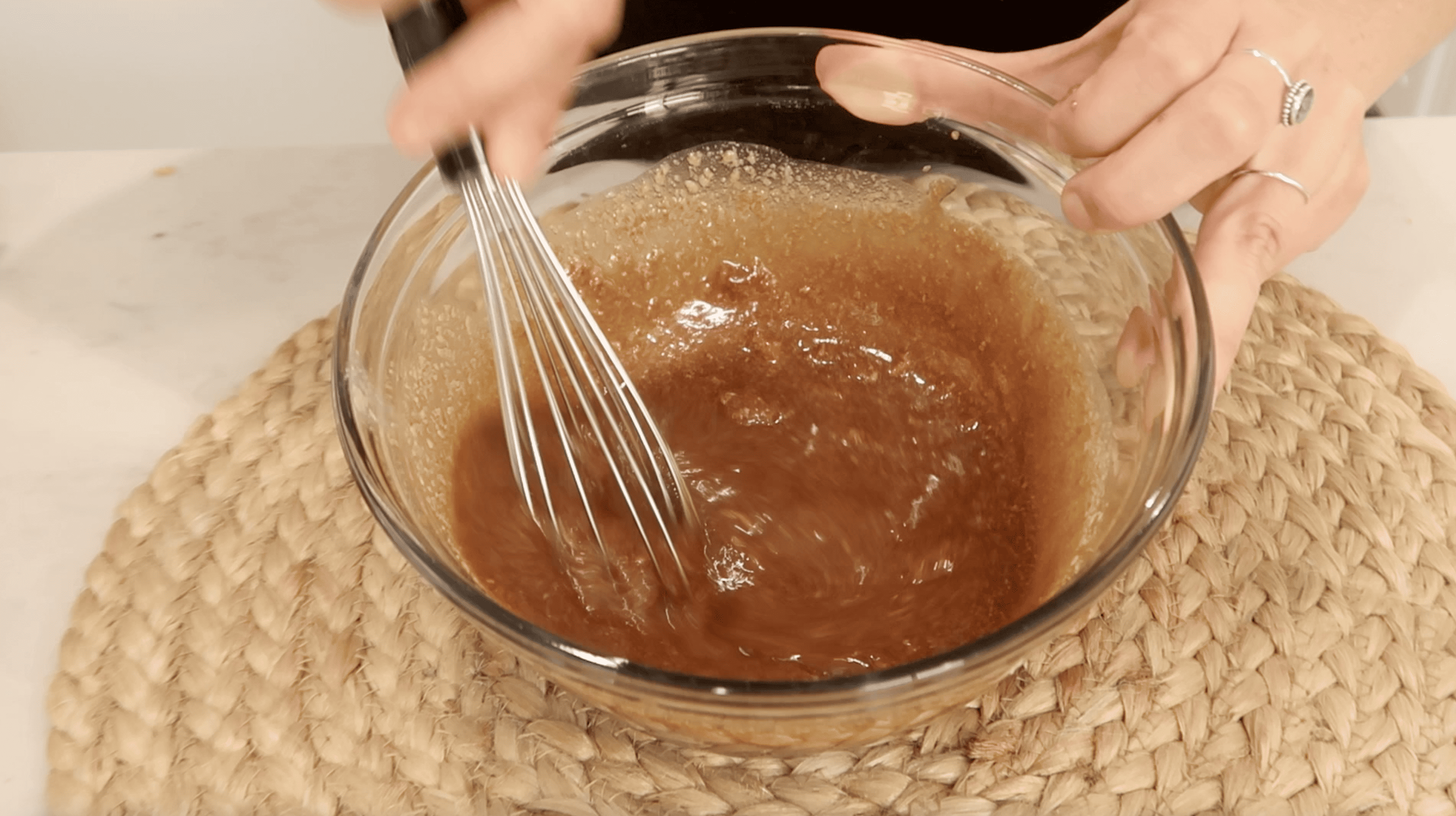 combining ingredients in a mixing bowl with whisk for the tare