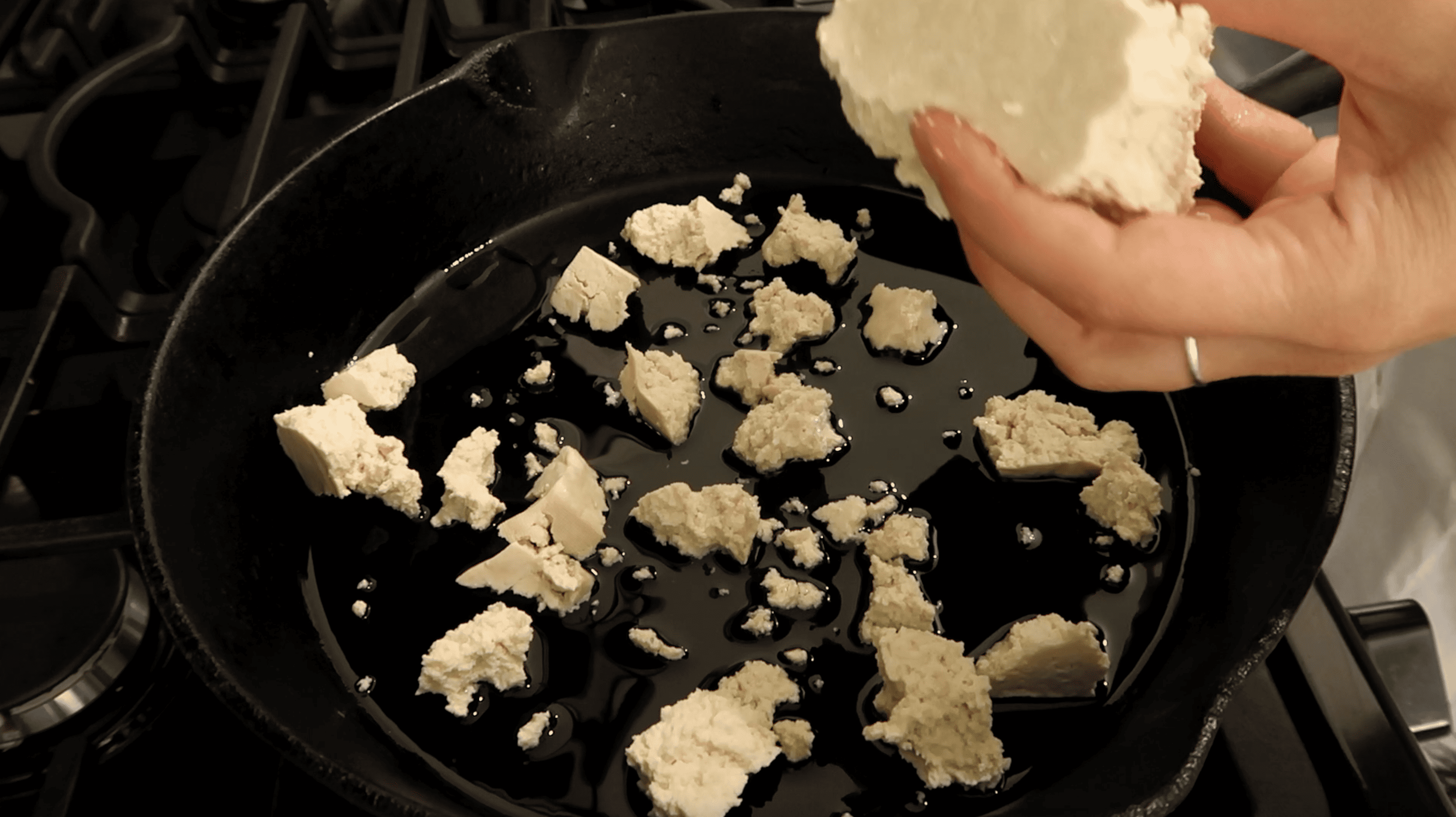 frying pan with tofu chunks