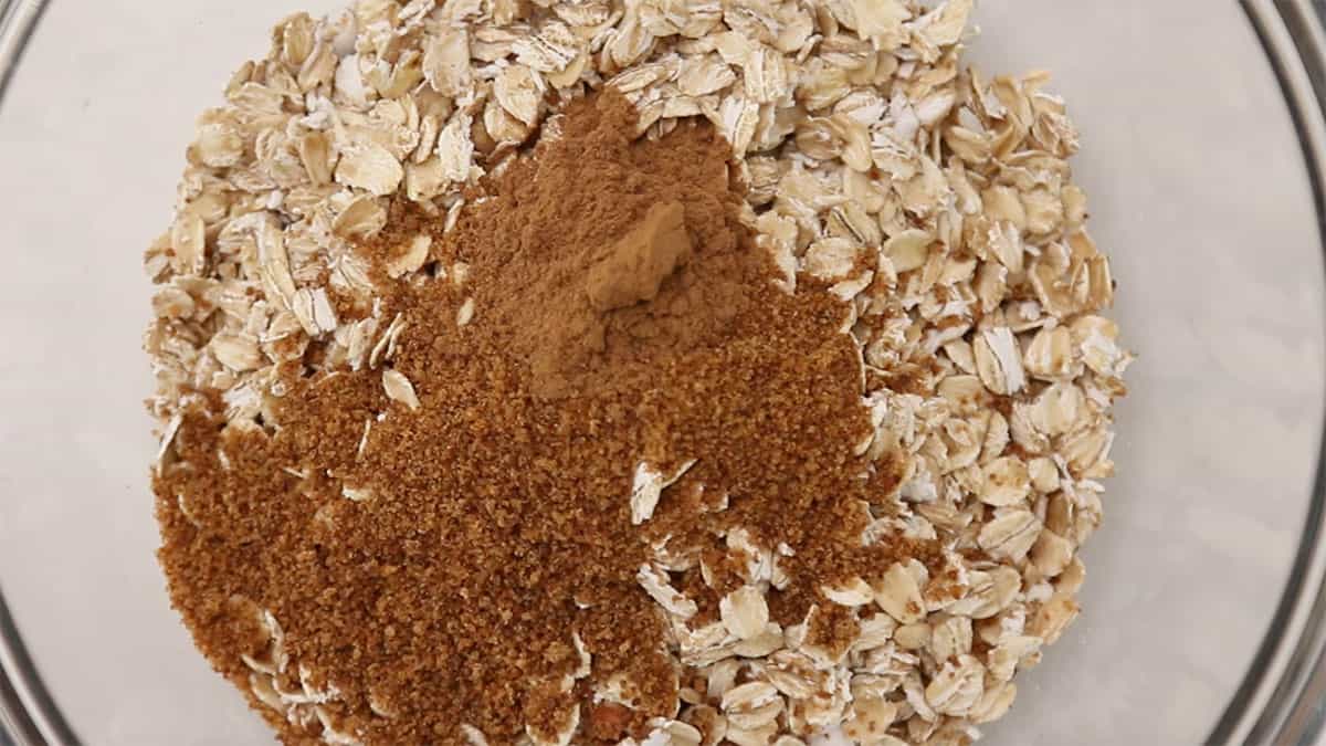 mixing bowl with oats, sugar, and cinnamon in it