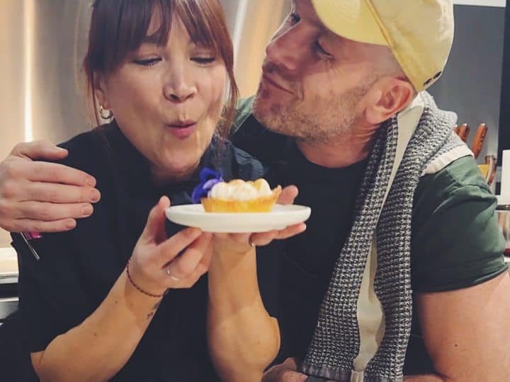chef Lauren Toyota at her Toronto event holding a lemon meringue tart